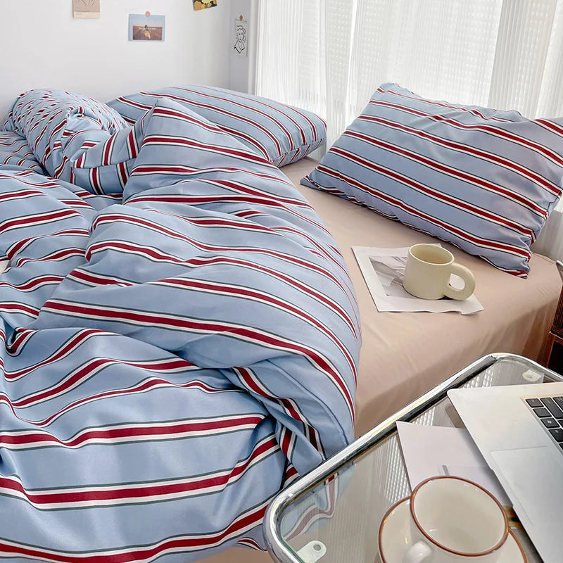Simple Red and Blue Striped Duvet Cover and Four Piece Bed Sheet Set with Washed Cotton Bedding on the Bed