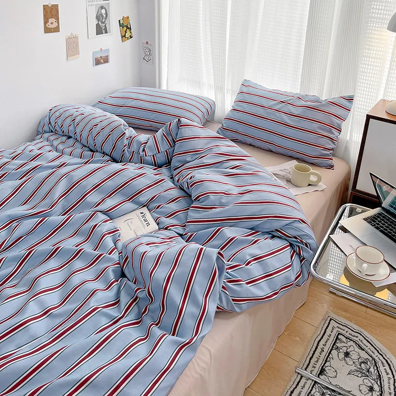 Simple Red and Blue Striped Duvet Cover and Four Piece Bed Sheet Set with Washed Cotton Bedding on the Bed